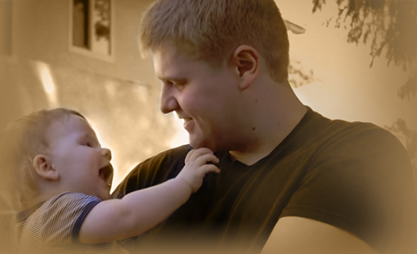Photo of Bloodhound Customer Holding Baby
